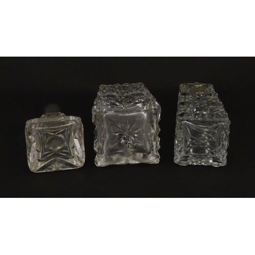 195A - Three assorted cut glass scent / perfume bottles with silver mounts, to include one hallmarked Birmi... 