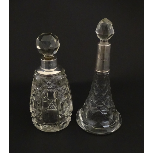 200A - Two cut glass scent / perfume bottles with silver mounts, one hallmarked Birmingham 1921, maker A J ... 