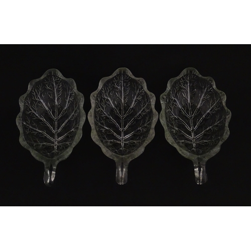 201 - A set of six glass avocado dishes of stylised leaf form. Approx. 7