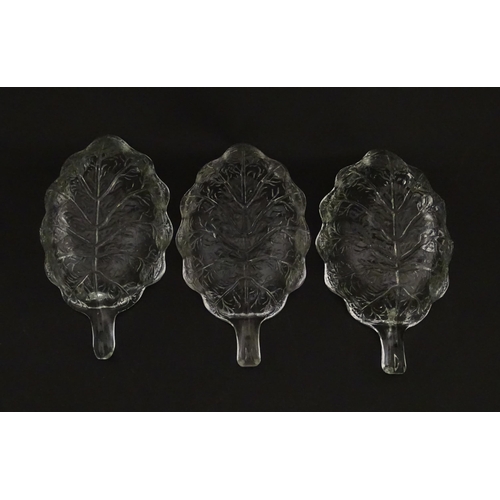 201 - A set of six glass avocado dishes of stylised leaf form. Approx. 7