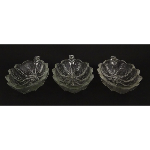 201 - A set of six glass avocado dishes of stylised leaf form. Approx. 7