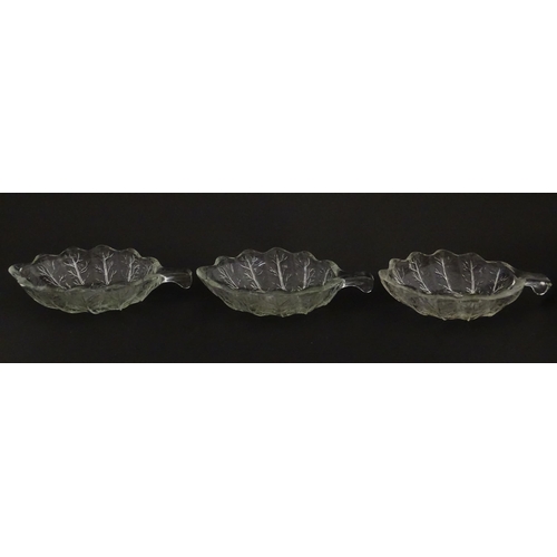 201 - A set of six glass avocado dishes of stylised leaf form. Approx. 7