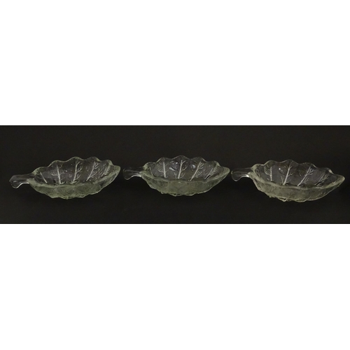 201 - A set of six glass avocado dishes of stylised leaf form. Approx. 7