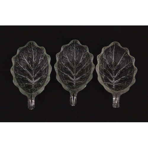 201 - A set of six glass avocado dishes of stylised leaf form. Approx. 7