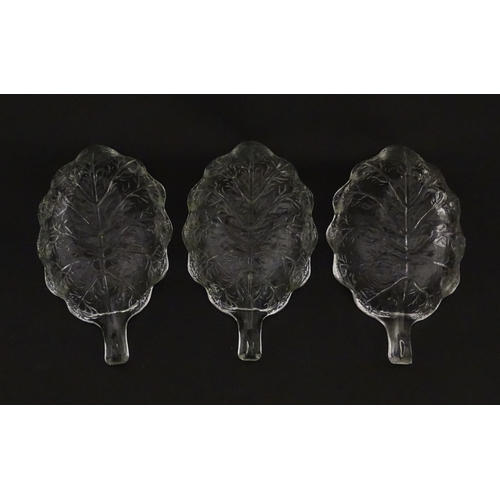 201 - A set of six glass avocado dishes of stylised leaf form. Approx. 7