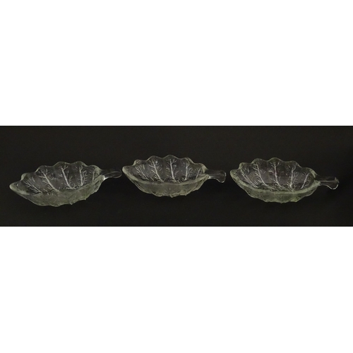 201 - A set of six glass avocado dishes of stylised leaf form. Approx. 7