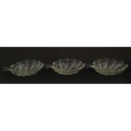 201 - A set of six glass avocado dishes of stylised leaf form. Approx. 7