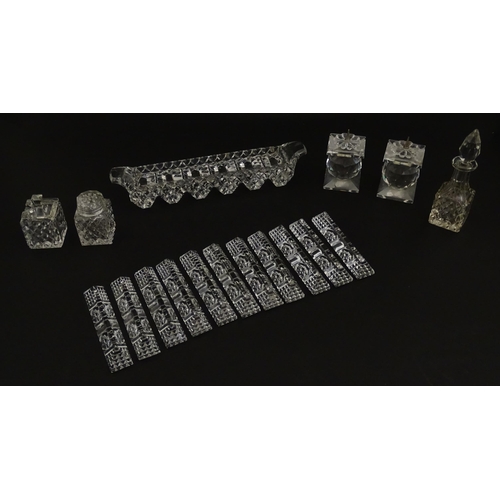 207 - Assorted glass items to include eleven knife rests, cruet, and candle stands of pricket form by Swar... 