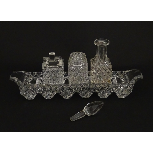 207 - Assorted glass items to include eleven knife rests, cruet, and candle stands of pricket form by Swar... 