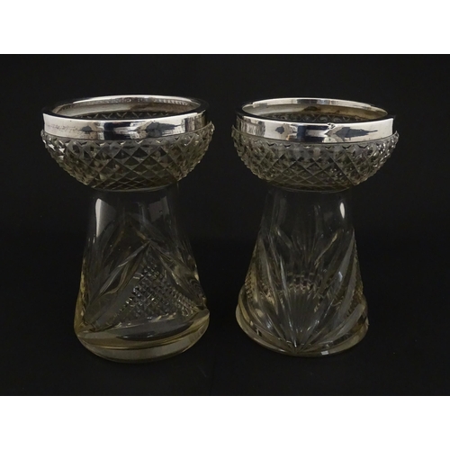 217 - A pair of cut glass vases with silver rims in the style of hyacinth vases, hallmarked Birmingham 190... 