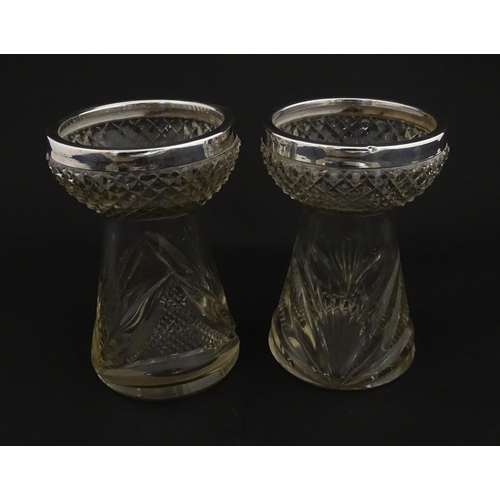 217 - A pair of cut glass vases with silver rims in the style of hyacinth vases, hallmarked Birmingham 190... 