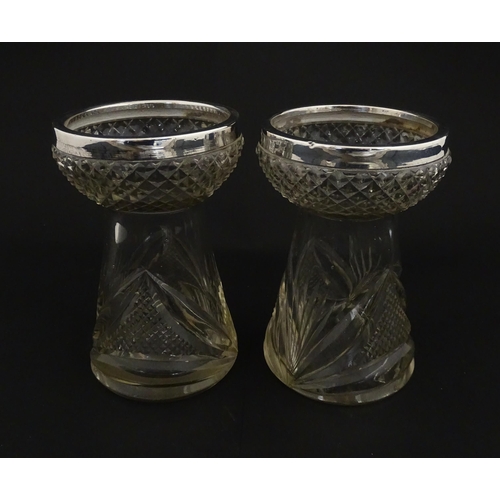 217 - A pair of cut glass vases with silver rims in the style of hyacinth vases, hallmarked Birmingham 190... 