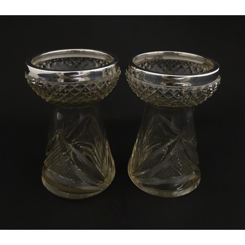 217 - A pair of cut glass vases with silver rims in the style of hyacinth vases, hallmarked Birmingham 190... 