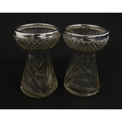 217 - A pair of cut glass vases with silver rims in the style of hyacinth vases, hallmarked Birmingham 190... 