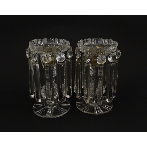 218 - A pair of 20thC cut glass table lustres / candle stands. Approx. 7