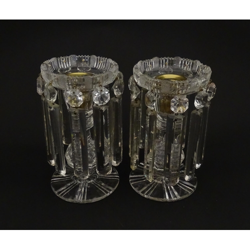 218 - A pair of 20thC cut glass table lustres / candle stands. Approx. 7