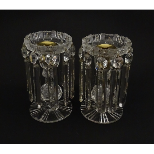 218 - A pair of 20thC cut glass table lustres / candle stands. Approx. 7