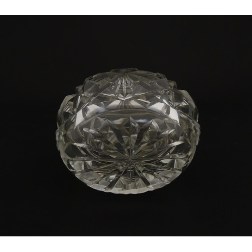 223 - A cut glass scent / perfume bottle with silver top hallmarked London C.1933 . Approx. 5 1/4