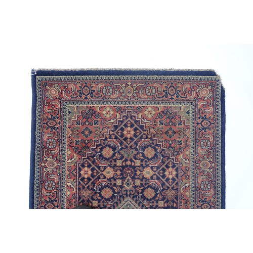 1372 - Carpet / Rug : A blue ground runner decorated with three central medallions with floral and scroll d... 