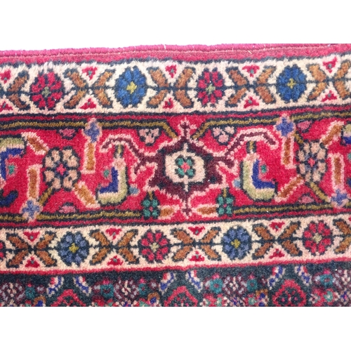 1396 - Carpet / Rug: A North West Persian Senneh rug, the red, blue and cream grounds decorated with repeat... 