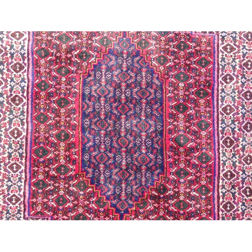 1396 - Carpet / Rug: A North West Persian Senneh rug, the red, blue and cream grounds decorated with repeat... 