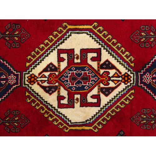 1397 - Carpet / Rug: A South West Persian qashgai runner, the red and blue ground with central geometric mo... 