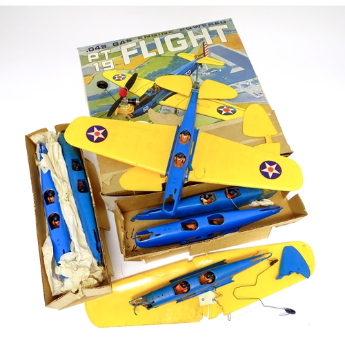 963A - Toy: A Cox PT 19 Flight Trainer .049 Gas Engine Powered model plane. Together with additional compon... 