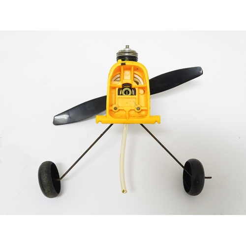 963A - Toy: A Cox PT 19 Flight Trainer .049 Gas Engine Powered model plane. Together with additional compon... 