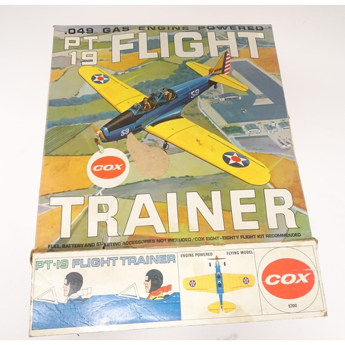 963A - Toy: A Cox PT 19 Flight Trainer .049 Gas Engine Powered model plane. Together with additional compon... 