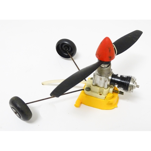 963A - Toy: A Cox PT 19 Flight Trainer .049 Gas Engine Powered model plane. Together with additional compon... 