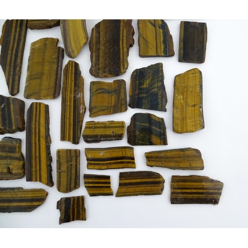 1093 - Natural History / Geology Interest: A quantity of hardstone tiger's eye specimen slices. Largest app... 