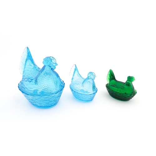 1155 - Three 20thC glass hen on nest egg containers, comprising two blue and one green. Largest approx. 8 1... 