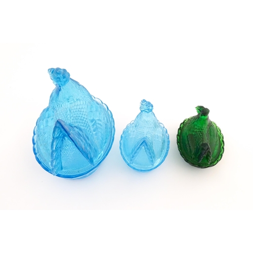 1155 - Three 20thC glass hen on nest egg containers, comprising two blue and one green. Largest approx. 8 1... 