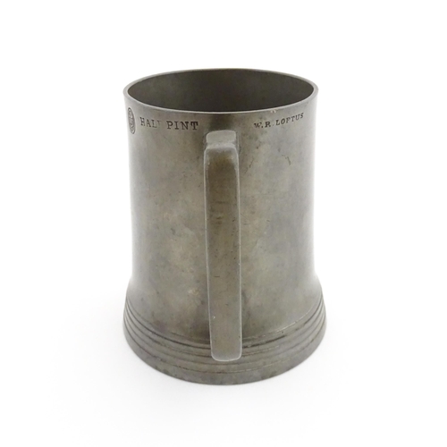 1156 - A Victorian pewter half pint tankard mug stamped W. R. Loftus, with a glass base, the body engraved ... 