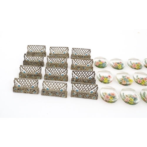 1164 - A quantity of assorted 20thC place card / menu holders to include twelve cast holders with turquoise... 