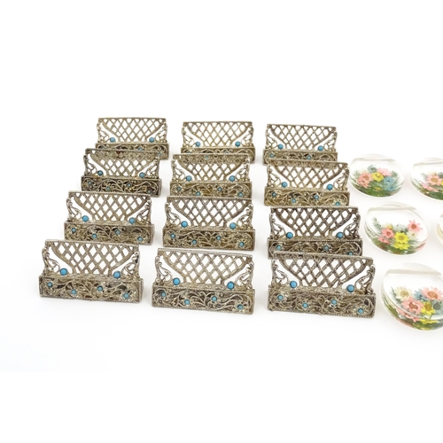 1164 - A quantity of assorted 20thC place card / menu holders to include twelve cast holders with turquoise... 