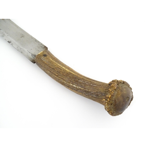 1171 - Kitchenalia : an early 20thC butcher's slicing knife, with antler handle, steel blade and wooden she... 