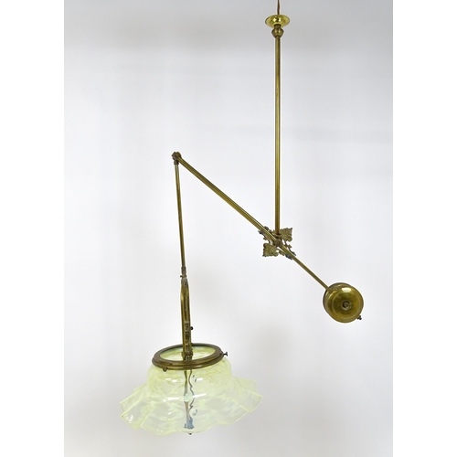 1399 - An Art Nouveau brass adjustable counter balance ceiling light with large flared vaseline glass shade... 