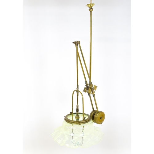 1399 - An Art Nouveau brass adjustable counter balance ceiling light with large flared vaseline glass shade... 