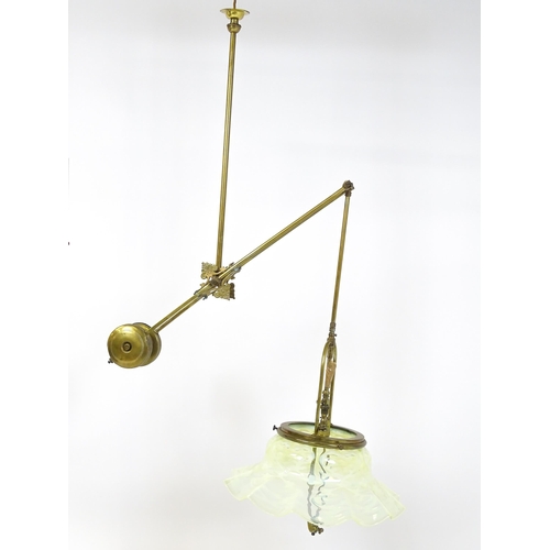 1399 - An Art Nouveau brass adjustable counter balance ceiling light with large flared vaseline glass shade... 