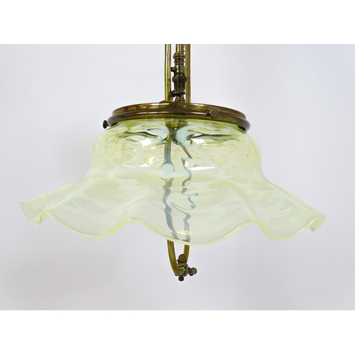 1399 - An Art Nouveau brass adjustable counter balance ceiling light with large flared vaseline glass shade... 