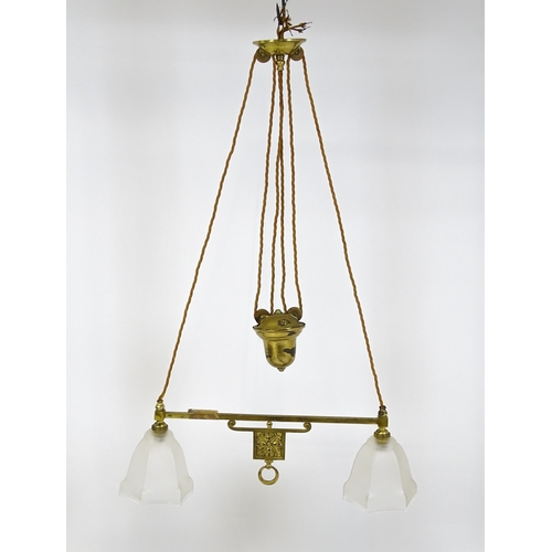 1402 - An early 20thC rise and fall adjustable height pendant light with with brass detail and twin frosted... 