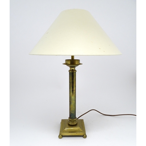 1417 - A brass table lamp of column form on squared base. Approx. 18