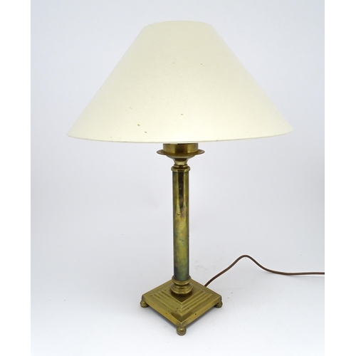 1417 - A brass table lamp of column form on squared base. Approx. 18