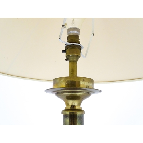 1417 - A brass table lamp of column form on squared base. Approx. 18