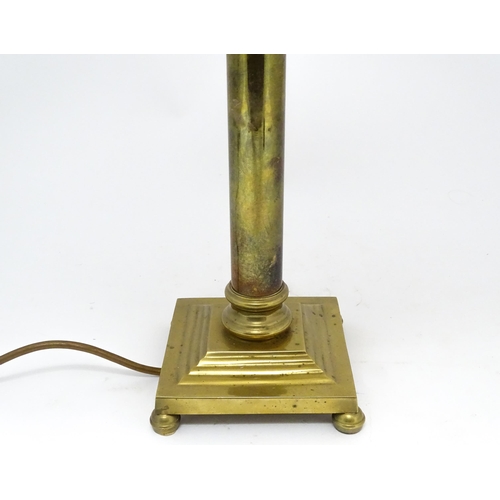 1417 - A brass table lamp of column form on squared base. Approx. 18