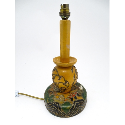 1418 - A 20thC turned wooden table lamp with painted detail depicting Mount Fuji, pagoda style buildings, e... 