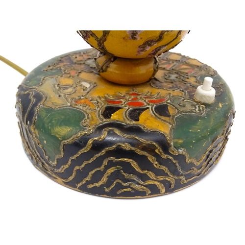 1418 - A 20thC turned wooden table lamp with painted detail depicting Mount Fuji, pagoda style buildings, e... 