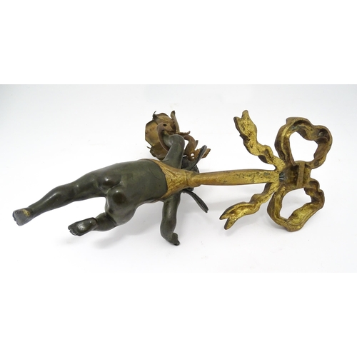 1421 - A cast bronze wall light sconce modelled as a cherub holding aloft a scrolling flower. Approx. 12