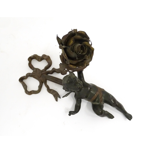 1421 - A cast bronze wall light sconce modelled as a cherub holding aloft a scrolling flower. Approx. 12